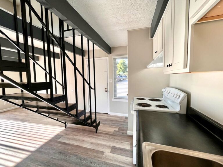 Jennings Avenue Apartments - apartment interior staircase and kitchen