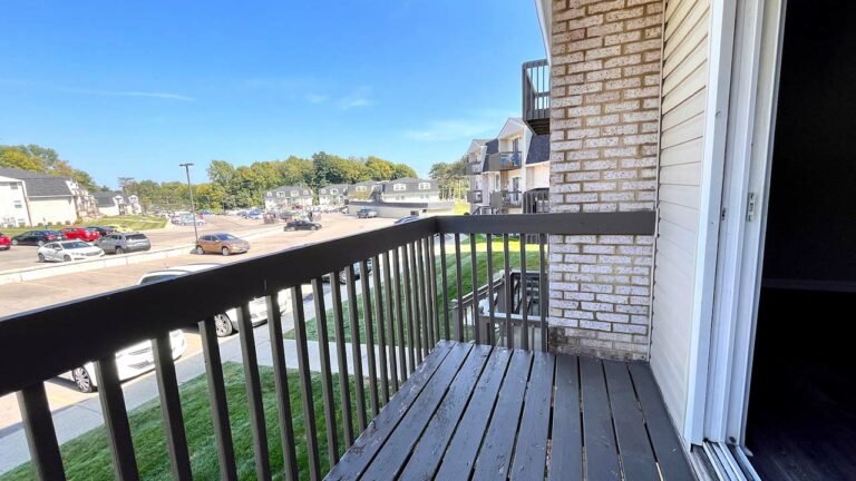 Pine Bridge Apartments - balcony overlooking parking lot