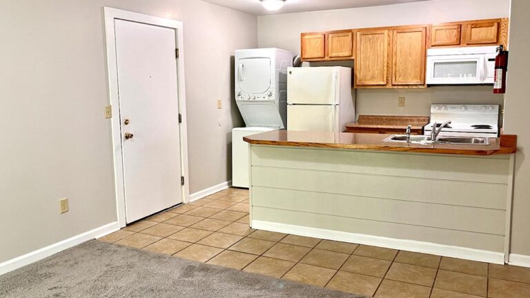 Pine Bridge Apartments galley kitchen with tile flooring