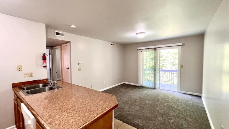 Pine Bridge Apartments galley kitchen opening into living area