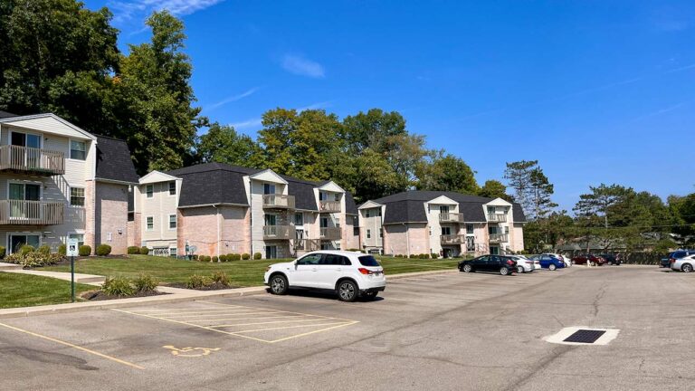 Pine Bridge Apartments - exterior property and parking lot