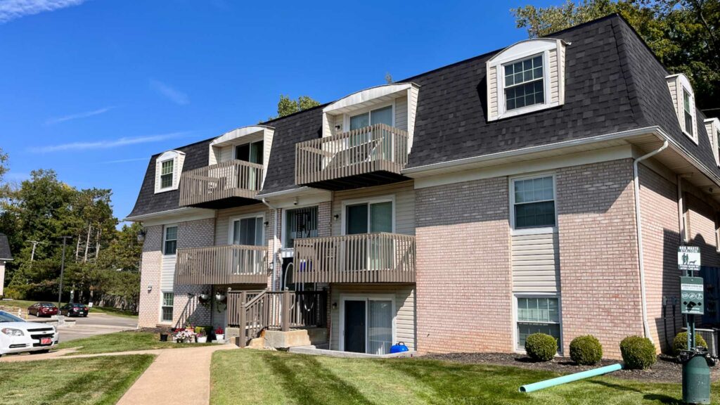 Pine Bridge Apartments with brick exterior, windows and balconies